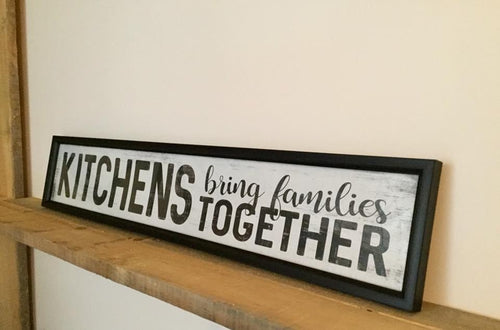 Kitchens bring families together wall decor encased in glass.