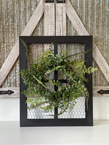 Rustic farmhouse wall decor including wreath