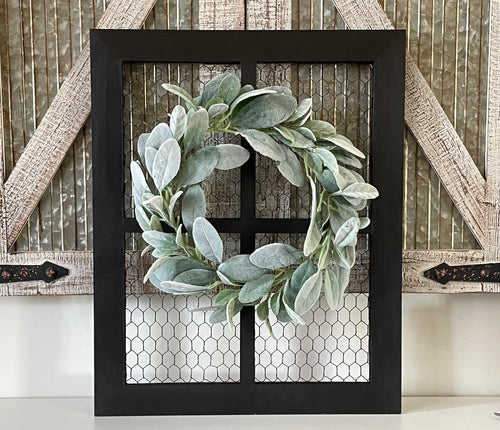 Rustic farmhouse wall decor including wreath