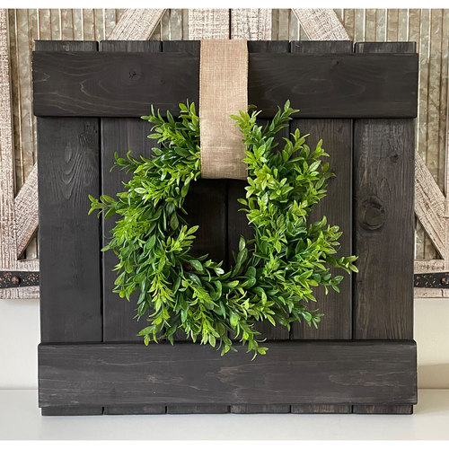 Rustic farmhouse wall decor including wreath