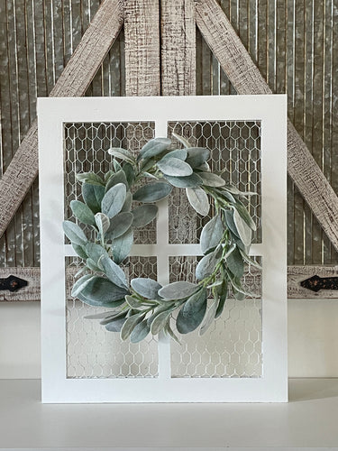 Rustic farmhouse wall decor including wreath